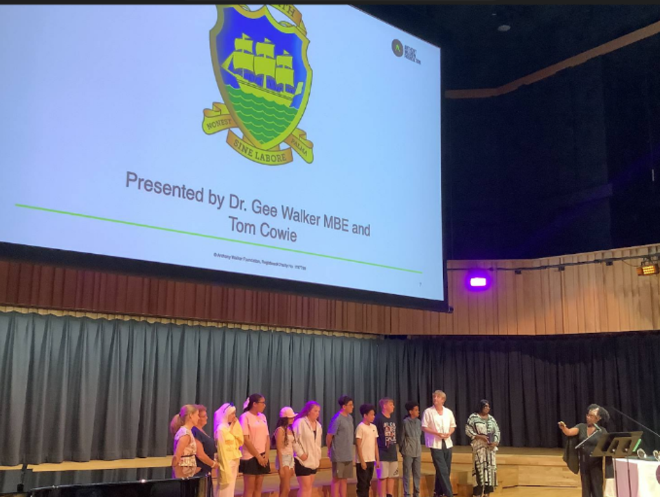 team in front of projector